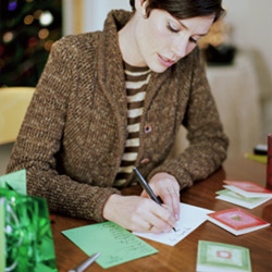 2e7e3-woman-writing-thank-you-card-250255b1255d